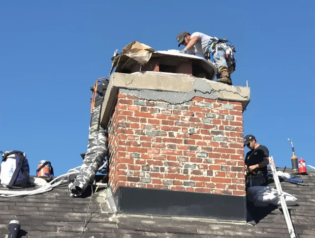 Chino Hills Chimney Sweep installing a custom chimney crown in Chino Hills, CA
