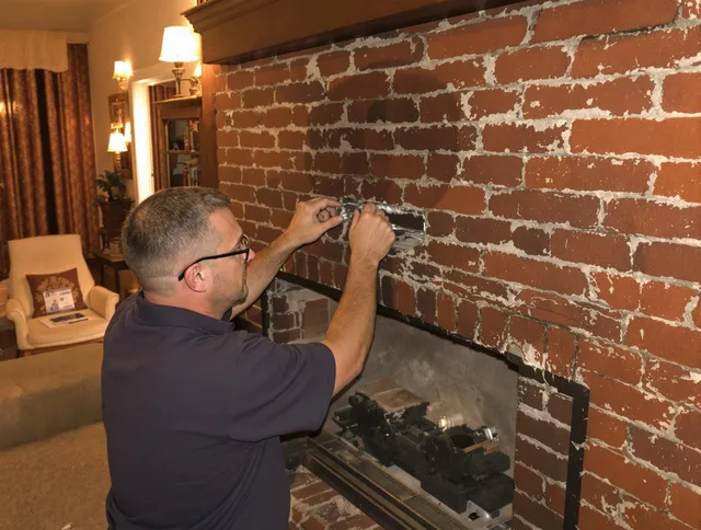 Chino Hills Chimney Sweep expert fixing a fireplace in Chino Hills, CA